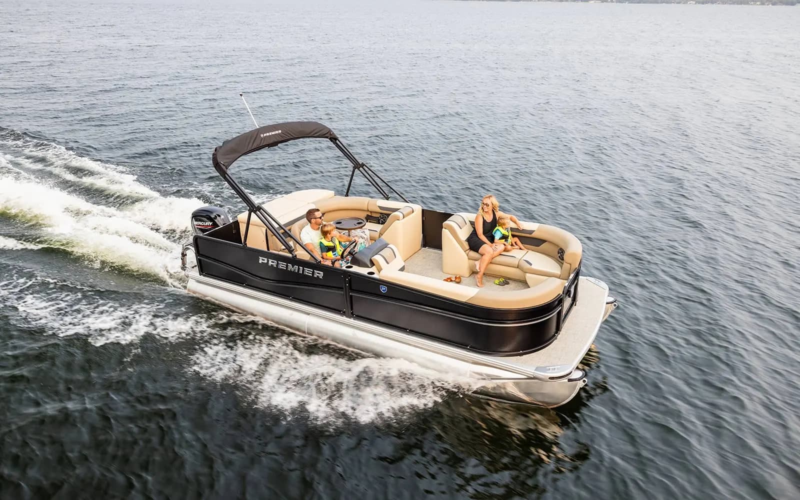 Family cruising on a black Premier pontoon